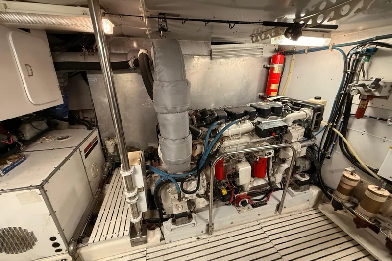 Slide: The Image of Engine room of a 2000 Northern Pacific Motor Yacht, showcasing mechanical and electrical components. - 86