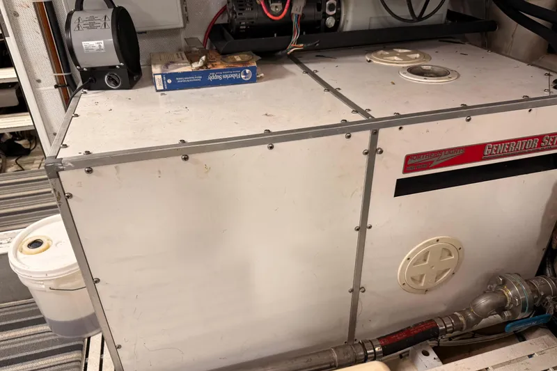 Slide: The Image of Engine room of a 2000 Northern Pacific Motor Yacht, featuring dual engines and safety equipment. - 87