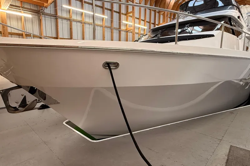 Slide: The Image of Anchor of 2000 Northern Pacific Motor Yacht, marked 60 KG, in a storage area. - 93