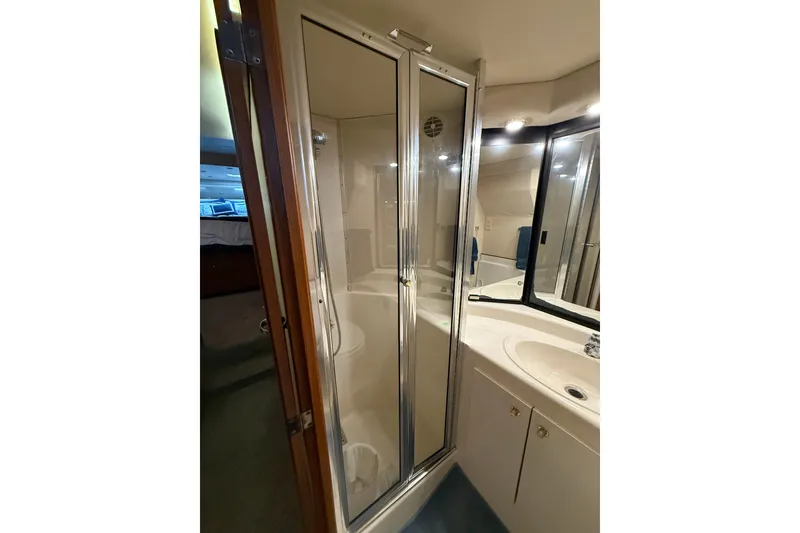 Slide: The Image of Bathroom interior of 1997 Bayliner 47 Motoryacht with shower and sink. - 18