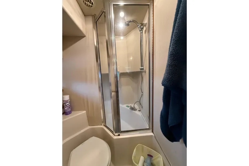 Slide: The Image of Bathroom of 1997 Bayliner 47 Motoryacht with shower and toilet. - 28