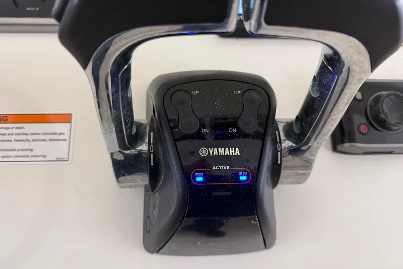 Slide: The Image of Yamaha throttle control on 2016 Cobia 296 Center Console boat dashboard. - 15