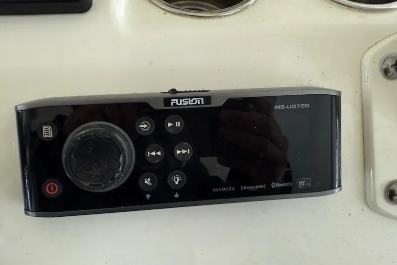Slide: The Image of Fusion MS-UD750 marine stereo on 2016 Cobia 296 Center Console boat dashboard. - 16