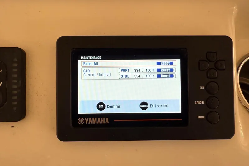 Slide: The Image of Yamaha maintenance display on 2016 Cobia 296 Center Console boat, showing reset options. - 17