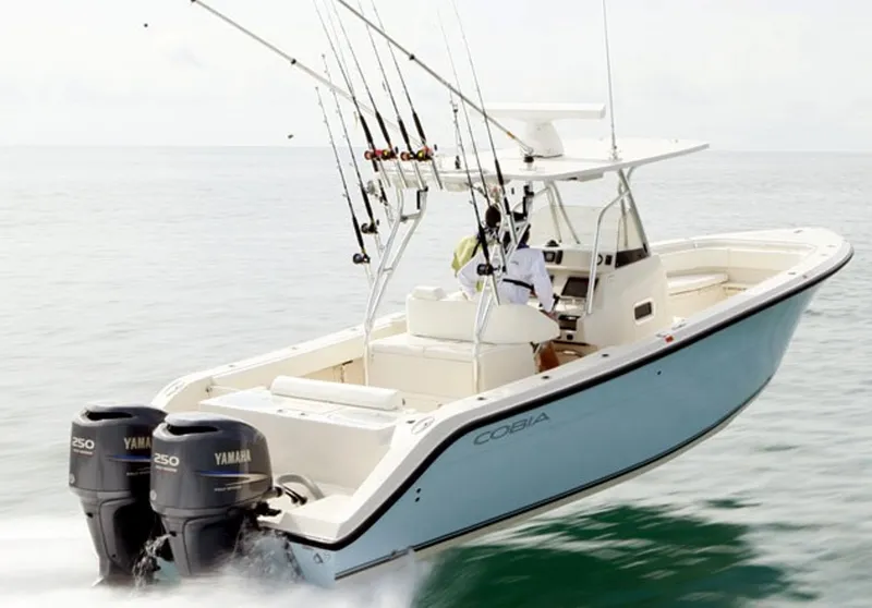 Slide: The Image of 2016 Cobia 296 Center Console boat seats, beige leather, dual seating arrangement. - 3