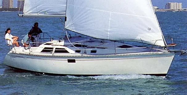 The Image of 1989 Hunter 35.5 sailboat named "Fantasy Hunter" docked at a marina. - 0
