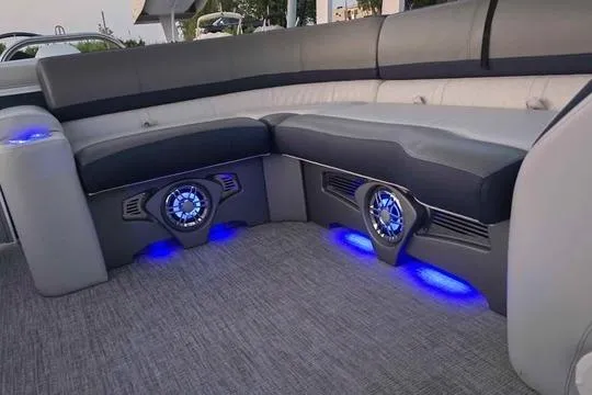 Slide: The Image of Luxurious seating with blue LED lights on 2023 Avalon Catalina Funship 2585 boat. - 10