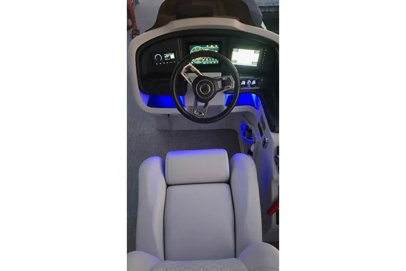 Slide: The Image of 2023 Avalon Catalina Funship 2585 helm with illuminated dashboard and modern steering wheel. - 17