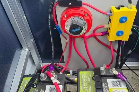 Slide: The Image of Electrical setup on 2023 Avalon Catalina Funship 2585 with batteries and wiring. - 18