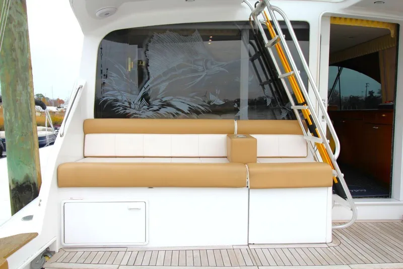 Slide: The Image of 1999 Ocean Yachts 60 Super Sport yacht seating area with ladder and etched glass design. - 14
