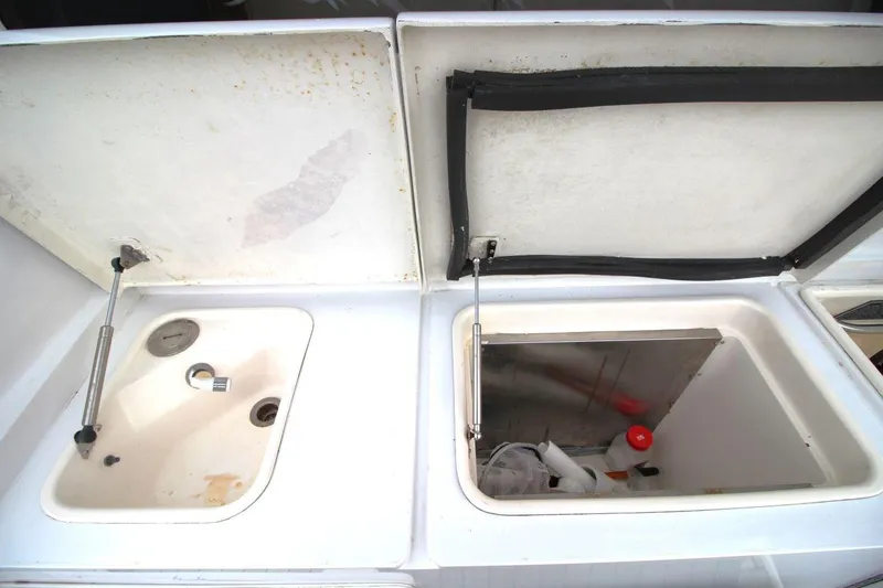 Slide: The Image of Open storage compartments on a 1999 Ocean Yachts 60 Super Sport boat. - 16