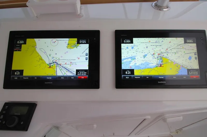 Slide: The Image of Garmin navigation screens on 1999 Ocean Yachts 60 Super Sport boat dashboard. - 29