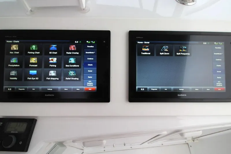 Slide: The Image of Garmin navigation displays on 1999 Ocean Yachts 60 Super Sport boat dashboard. - 30