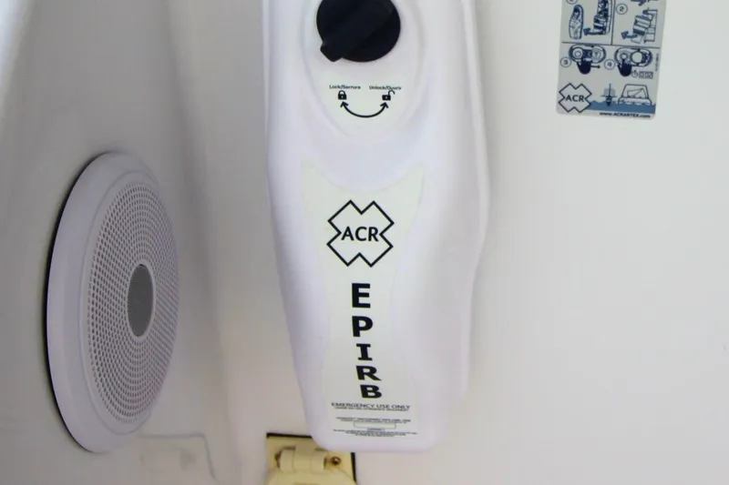Slide: The Image of EPIRB device on 1999 Ocean Yachts 60 Super Sport, featuring ACR branding. - 35