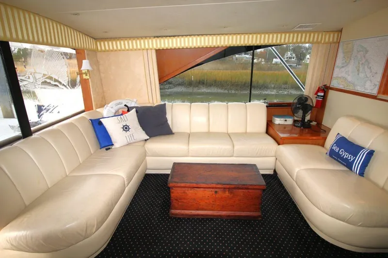 Slide: The Image of Luxurious interior of 1999 Ocean Yachts 60 Super Sport with cream leather seating and nautical decor. - 41