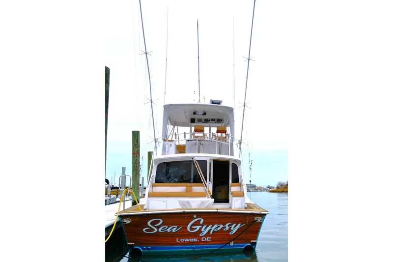 Slide: The Image of 1999 Ocean Yachts 60 Super Sport boat named "Sea Gypsy" docked in Lewes, DE. - 5