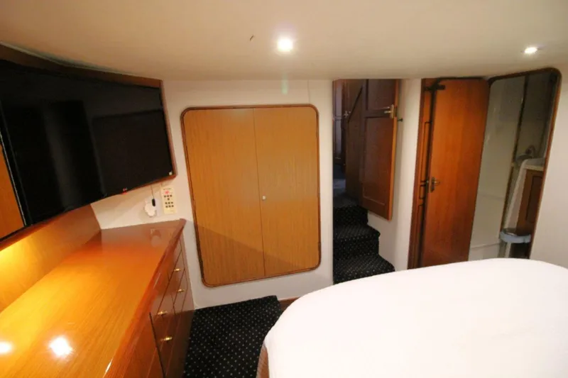 Slide: The Image of Luxurious interior of 1999 Ocean Yachts 60 Super Sport with wood finishes and modern amenities. - 50
