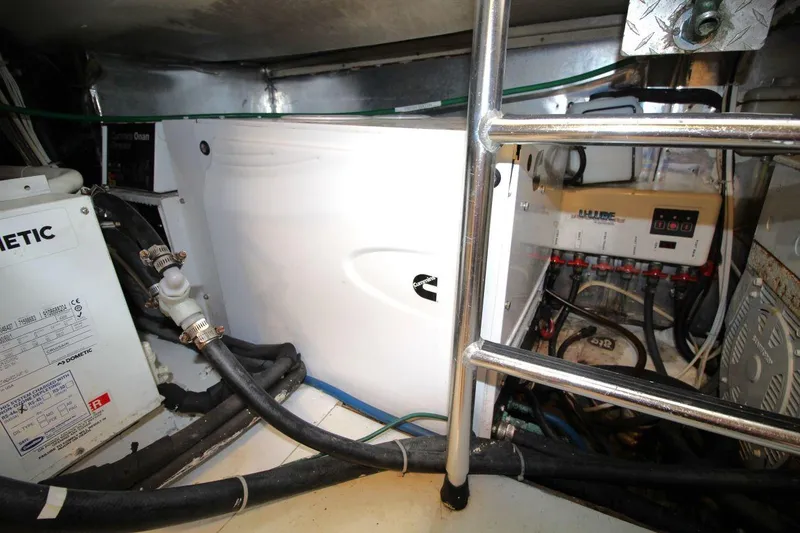 Slide: The Image of Engine room of 1999 Ocean Yachts 60 Super Sport with visible equipment and wiring. - 66