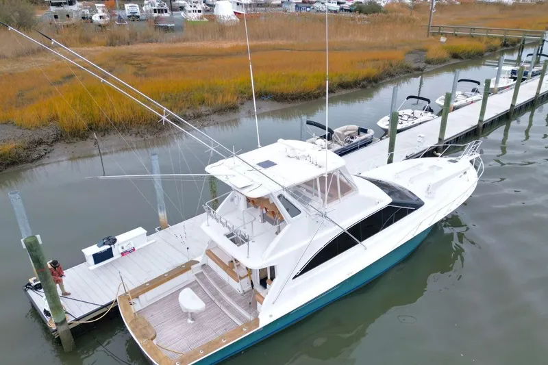 Slide: The Image of Aerial view of 1999 Ocean Yachts 60 Super Sport docked at a marina. - 10