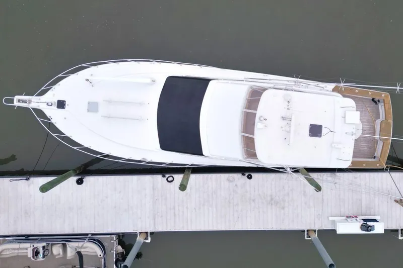 Slide: The Image of Overhead view of a 1999 Ocean Yachts 60 Super Sport docked at a marina. - 11