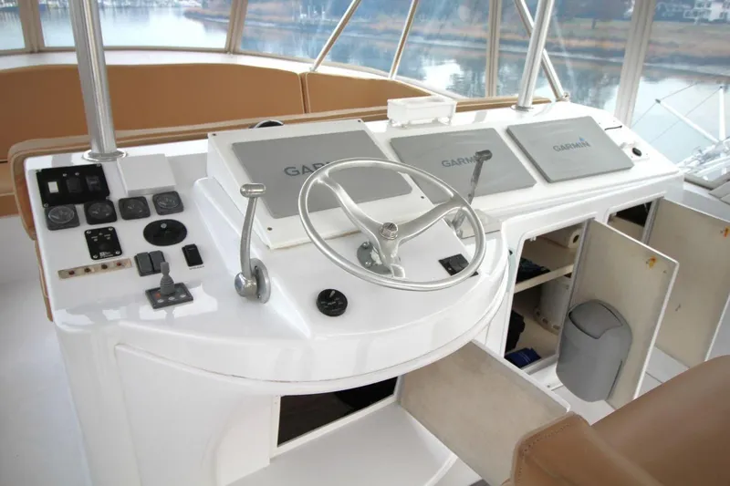 Slide: The Image of 1999 Ocean Yachts 60 Super Sport helm with Garmin navigation and control panel. - 27