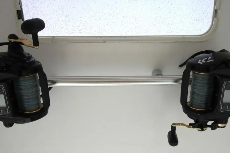 Slide: The Image of Fishing reels on Ocean Yachts 60 Super Sport, 1999 model, mounted on a rod holder. - 36