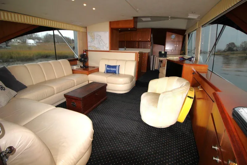 Slide: The Image of Luxurious interior of 1999 Ocean Yachts 60 Super Sport with plush seating and elegant decor. - 38