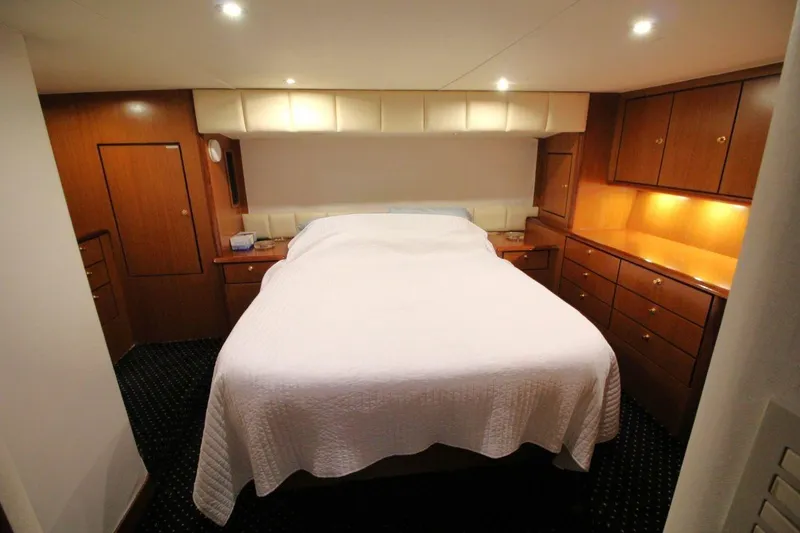 Slide: The Image of Luxurious bedroom interior of 1999 Ocean Yachts 60 Super Sport with wood cabinetry. - 47