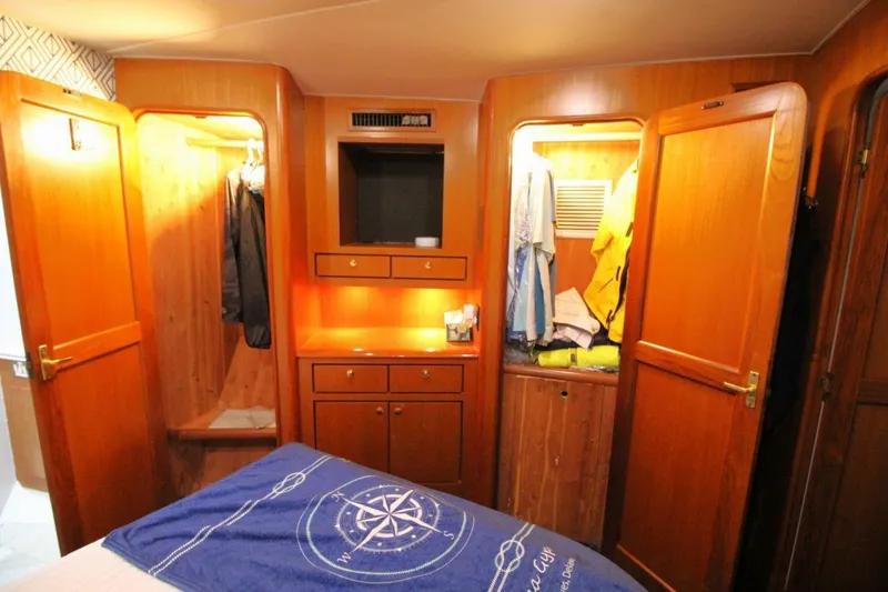 Slide: The Image of Interior of 1999 Ocean Yachts 60 Super Sport with wooden closets and storage. - 58