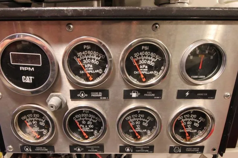 Slide: The Image of Control panel of a 1999 Ocean Yachts 60 Super Sport with various gauges and indicators. - 64