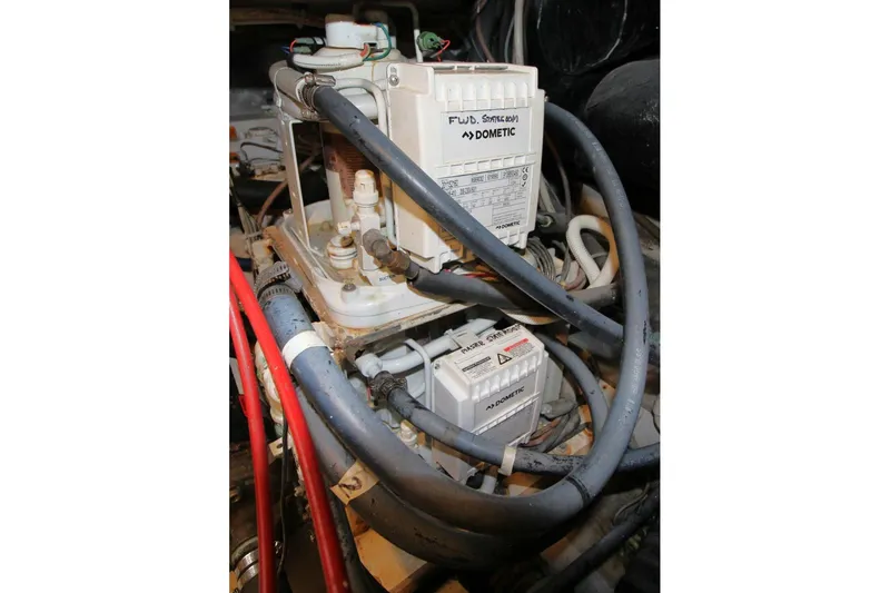 Slide: The Image of Engine room of 1999 Ocean Yachts 60 Super Sport with Dometic equipment and hoses. - 70