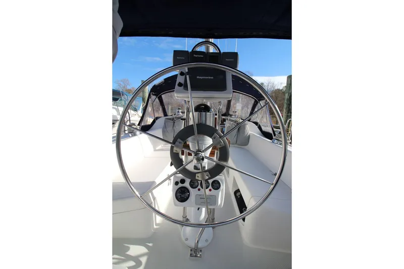 Slide: The Image of Steering wheel of a 2003 Catalina 320 sailboat with navigation instruments. - 14