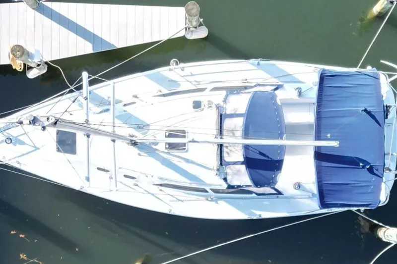 Slide: The Image of Aerial view of a 2003 Catalina 320 sailboat docked at a marina. - 8