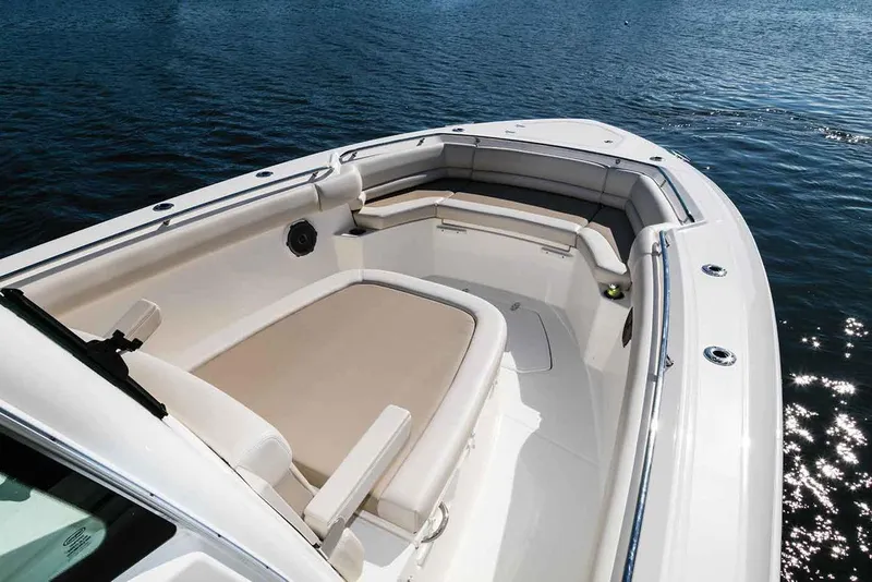 Slide: The Image of Manufacturer Provided Image: 2017 Boston Whaler 330 Outrage boat bow seating area on water. - 8