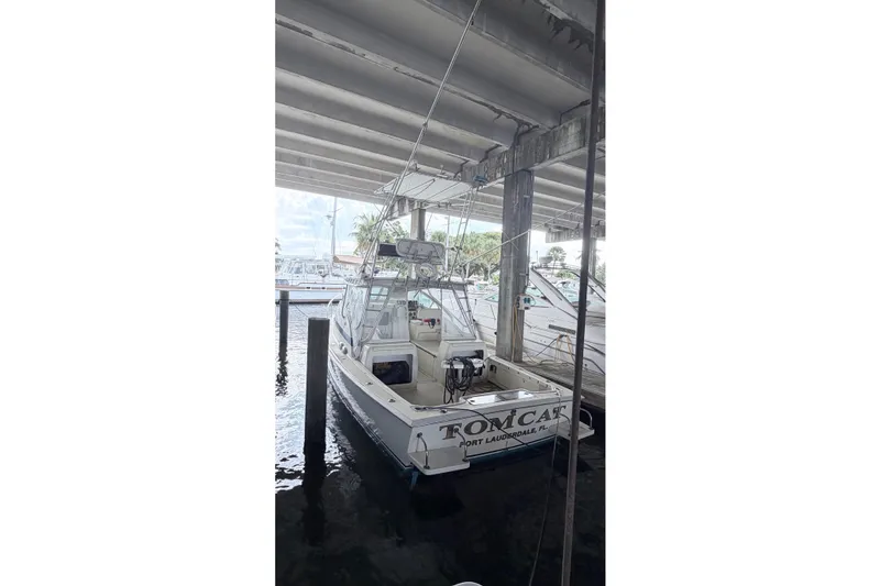 Slide: The Image of 1968 Bertram 31 Bahia Mar docked under a covered marina in Fort Lauderdale. - 25