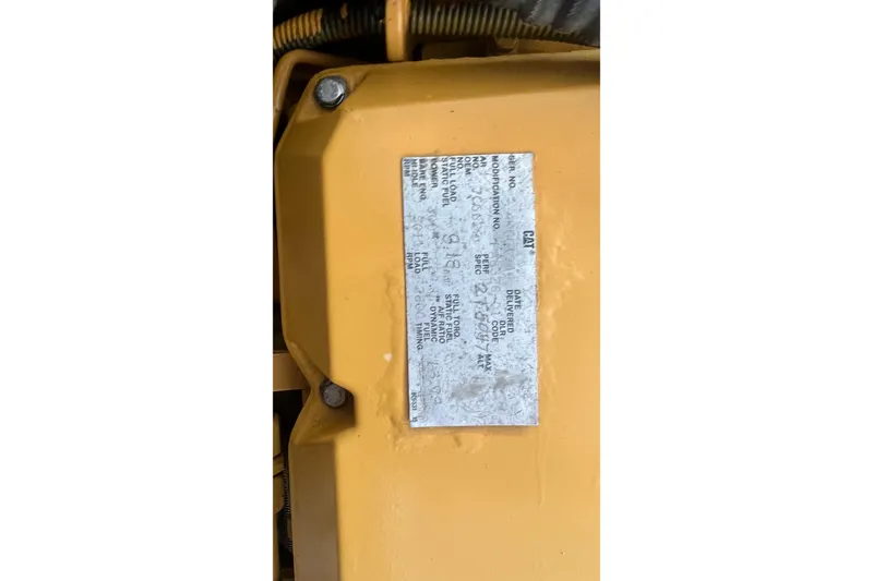 Slide: The Image of Engine label on a 1968 Bertram 31 Bahia Mar boat, featuring technical specifications. - 7