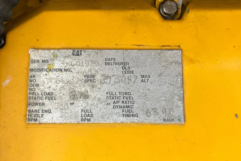 Slide: The Image of Yellow engine plate with specifications for a 1968 Bertram 31 Bahia Mar. - 9