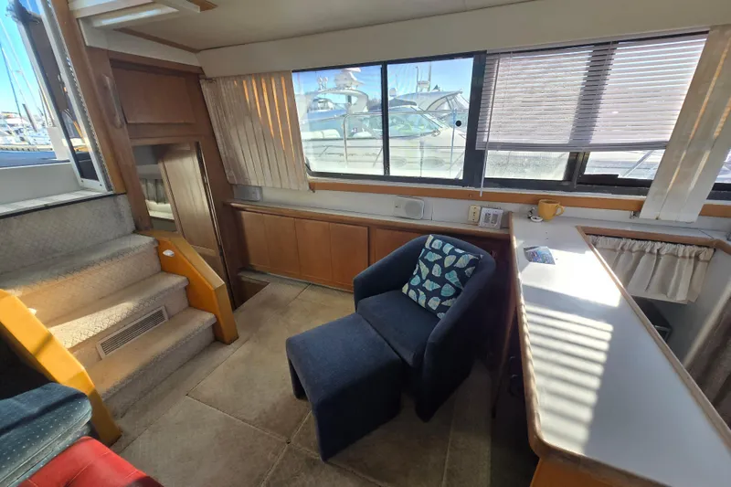 Slide: The Image of Interior of 1995 Carver 430 Cockpit Motor Yacht with seating and window view. - 10