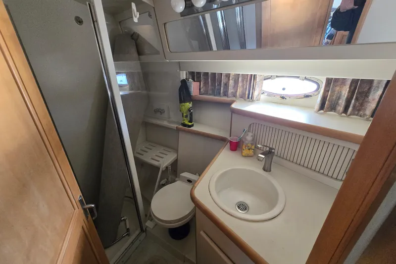 Slide: The Image of Bathroom interior of 1995 Carver 430 Cockpit Motor Yacht with shower and sink. - 15