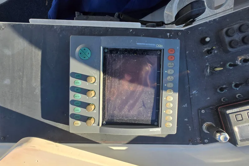 Slide: The Image of Control panel of a 1995 Carver 430 Cockpit Motor Yacht with navigation equipment. - 36