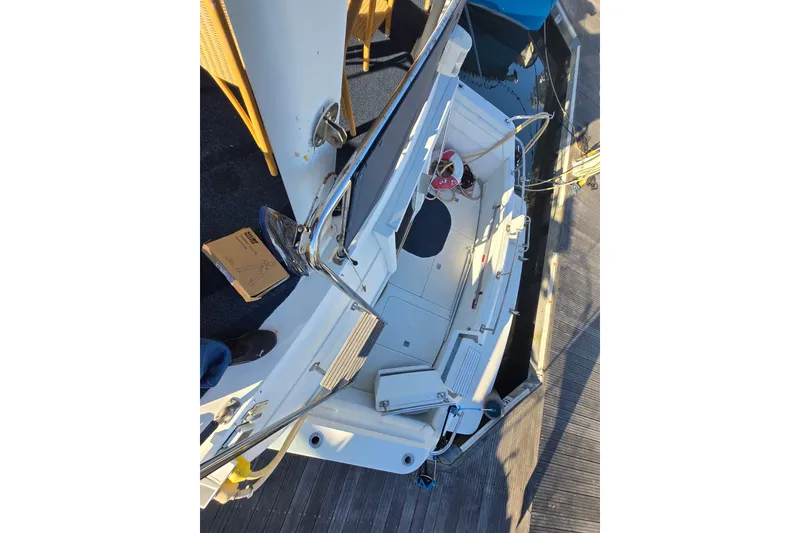 Slide: The Image of 1995 Carver 430 Cockpit Motor Yacht docked, showing deck and cockpit area. - 40