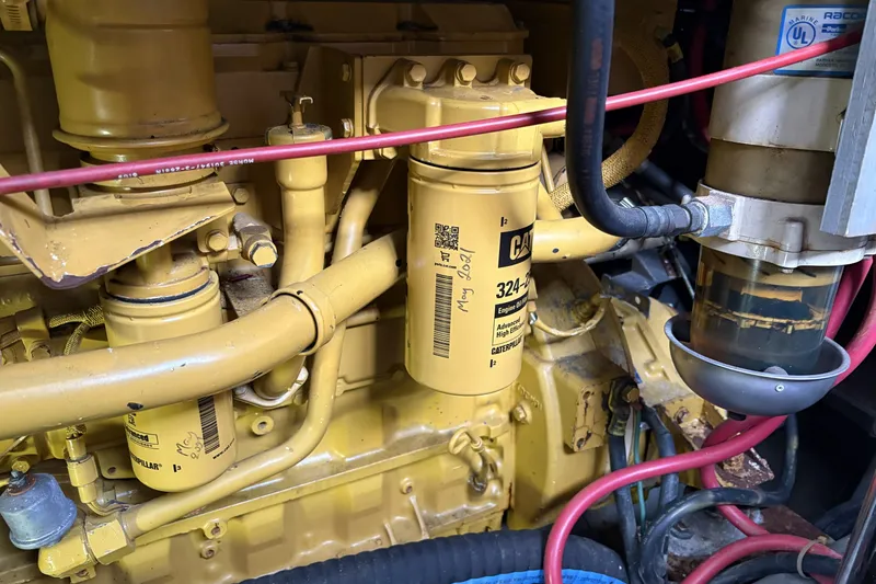 Slide: The Image of Engine compartment of a 1999 Carver 430 Cockpit Motor Yacht with Caterpillar filters. - 47