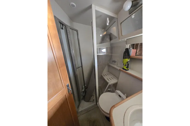 Slide: The Image of Bathroom interior of 1995 Carver 430 Cockpit Motor Yacht with shower and toilet. - 16
