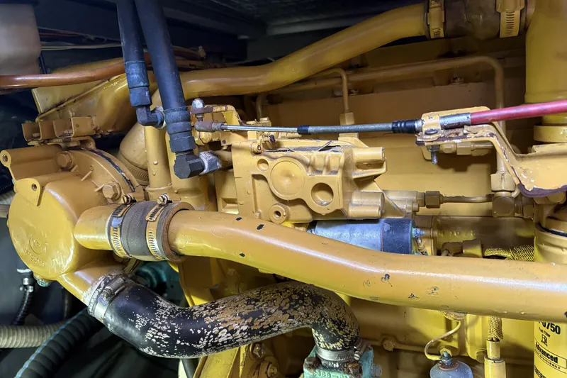 Slide: The Image of Engine components of a 1999 Carver 430 Cockpit Motor Yacht, showcasing detailed mechanical parts. - 48