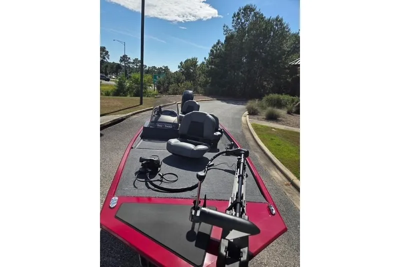 Slide: The Image of 2026 Tracker Bass Tracker Classic XL boat on a sunny day, parked on a road. - 3
