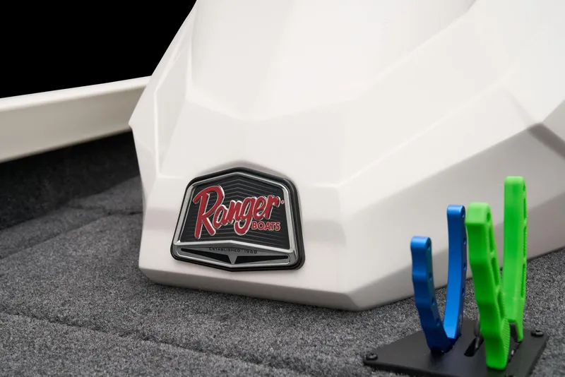 Slide: The Image of 2026 Ranger RT198P boat storage compartment with carpeted interior and secure latch. - 18