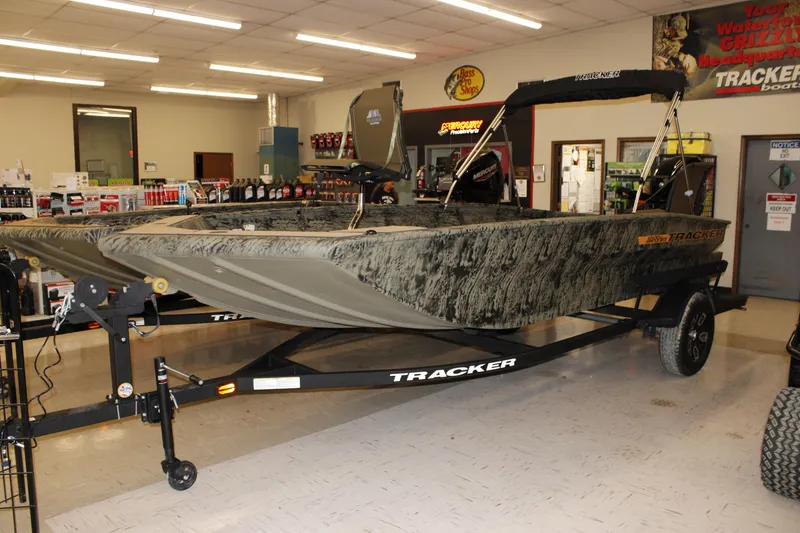 The Image of 2026 Tracker Grizzly 1756 T Marsh boat displayed in showroom on trailer. - 0