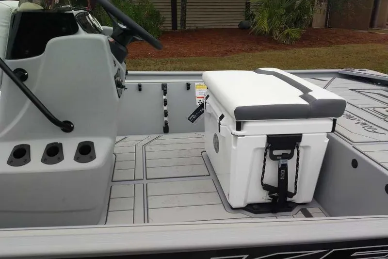 Slide: The Image of 2026 Tracker Bass Tracker Classic CC boat interior with white cooler seat. - 2