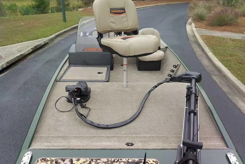 Slide: The Image of 2026 Tracker Bass Tracker Classic Limited boat with seating and fishing equipment. - 2