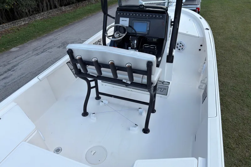 Slide: The Image of 2019 Wellcraft 241 Bay boat interior with steering console and seating. - 12